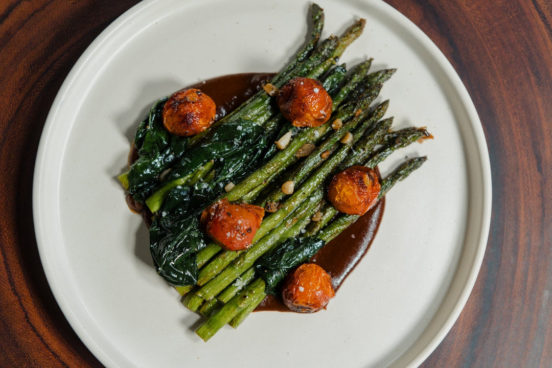 Charred Asparagus, Cherry Tomatoes & Garlicky Greens with Mole Coloradito